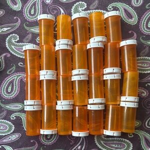 Clear Orange and White CVS pill bottles. Approximately 4 inches by 2 inches. Med